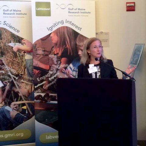 Next Century Cities Exec Director Deb Socia welcomes attendees to the Digital New England regional summit in Portland, Maine