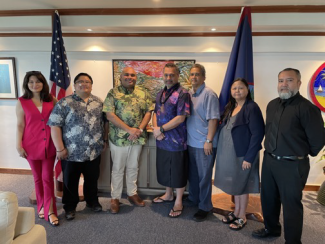A group of people gathered together in Guam